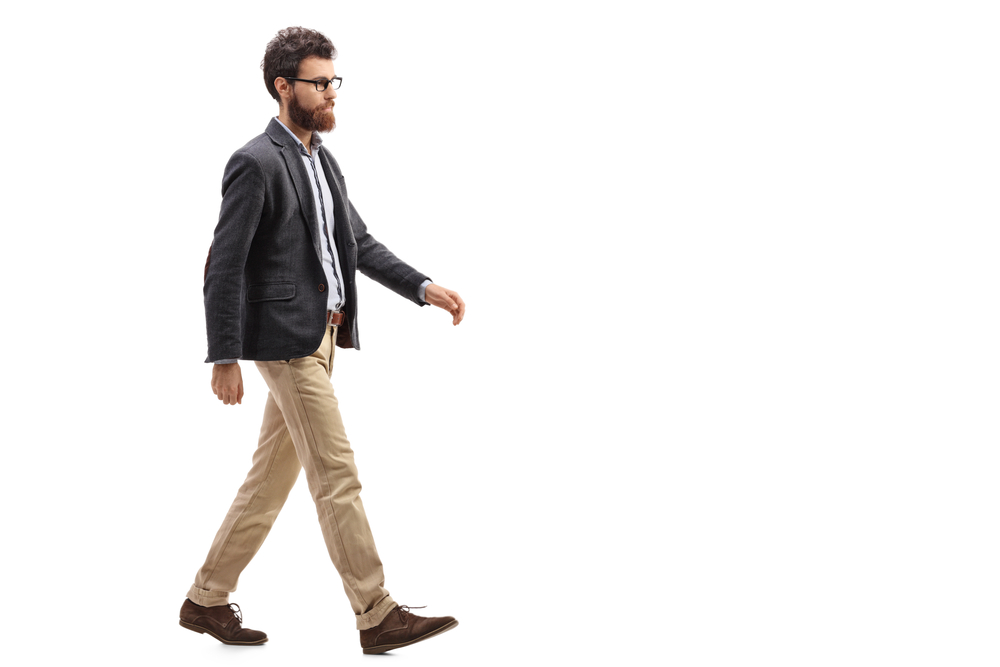 Guy walking across white background