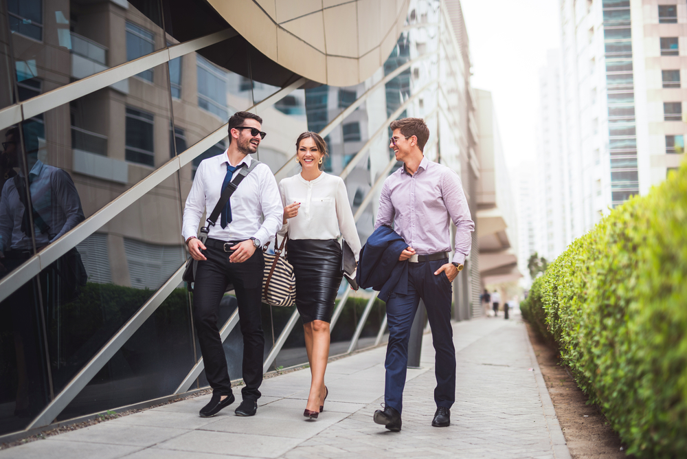 group of young professionals taking a walk along a downtown
