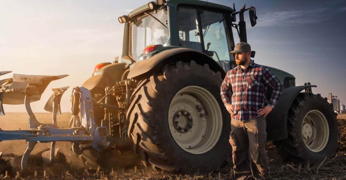 Planting the Seeds of Safety in the Agriculture Industry 3 man in plaid standing in front of tractor