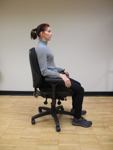 girl sitting in chair with good posture