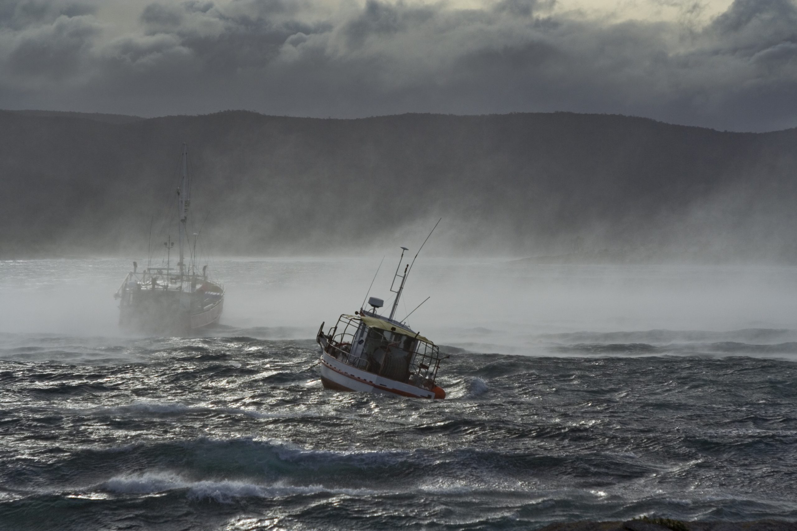 Fishing boat in misty water