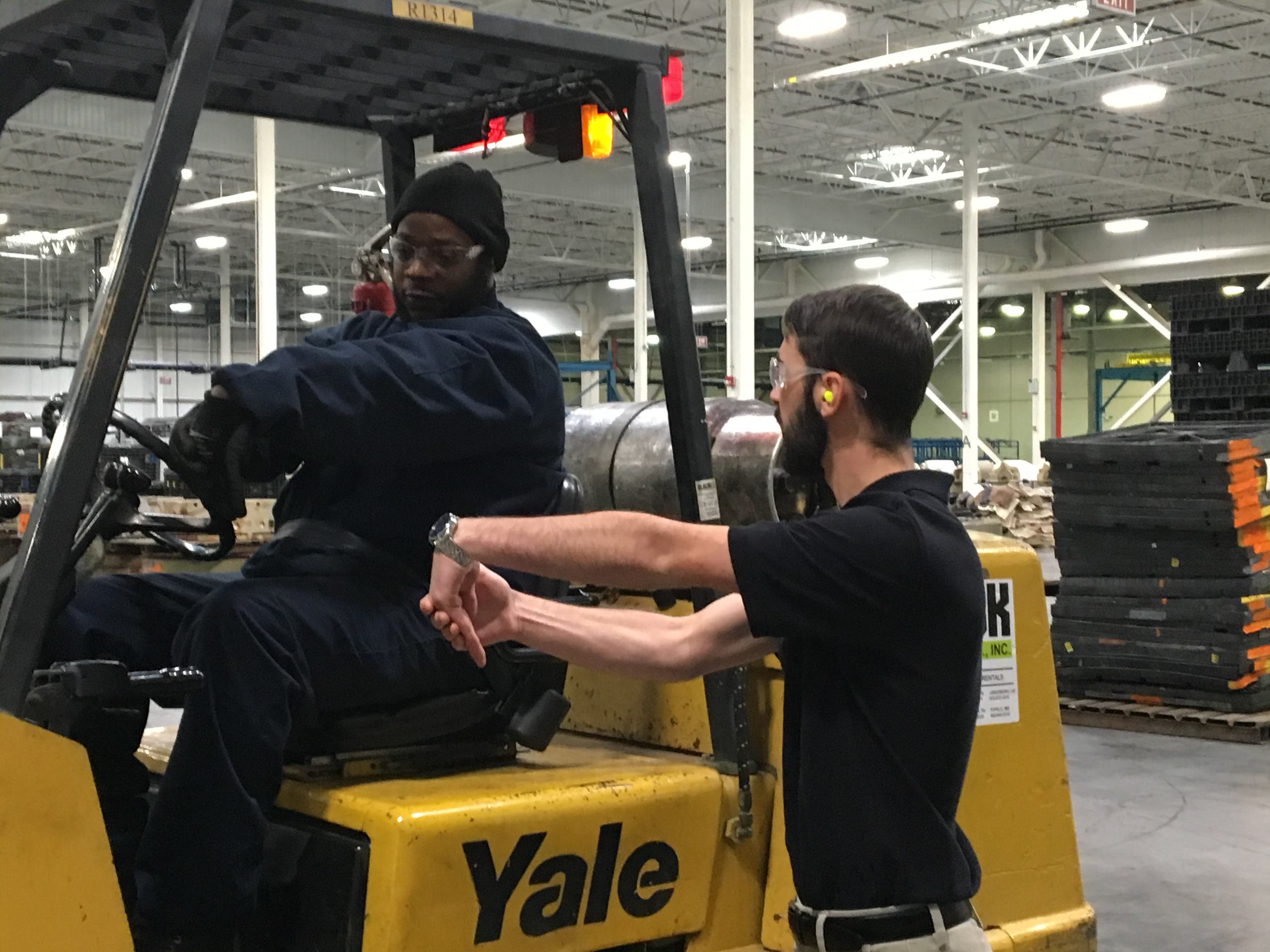 Guy and Girl working on machine